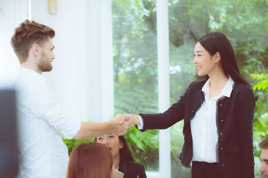 business people colleagues handshake with success during meeting.