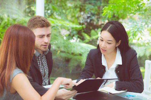 young business people making meeting and talking for analyzing marketing working at office on desk.