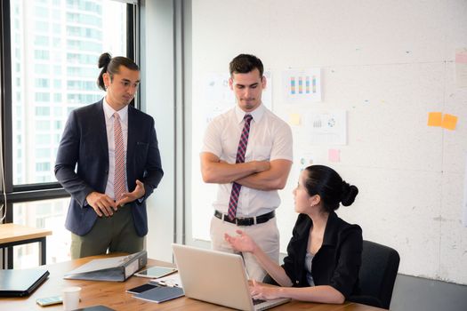 Business team having using laptop during a meeting and presents.