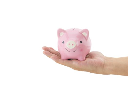 Business man holding a piggy bank isolated on white background.