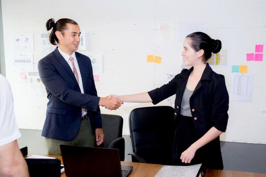 successful business partner shaking hands after with meeting in the office.