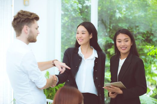 business people colleagues handshake with success during meeting.