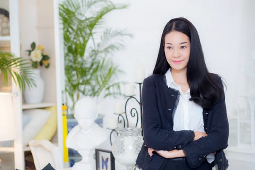 business woman in the office looking happy and smiling.