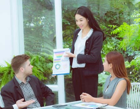 young business people making meeting and talking for analyzing marketing working at office on desk.