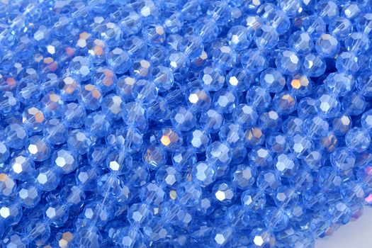 Beautiful Light Blue Glass Sparkle Crystal Isoalted Beads on white background. Use for diy beaded jewelry. Space for text