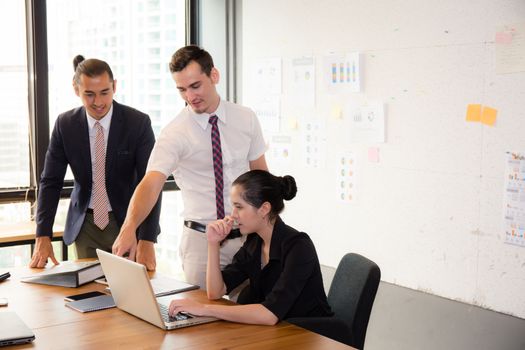 Business team having using laptop during a meeting and presents.