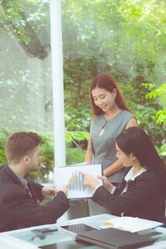 young business people making meeting and talking for analyzing marketing working at office on desk.