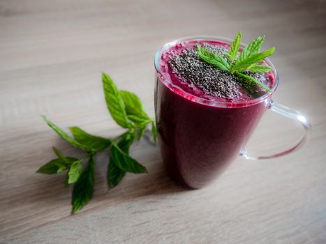 Red berry smoothie with mint leaves. Red smoothie.