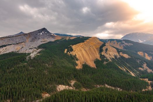 Wide angle shot of a golden glow on the Rocky Mountains  in the afternoon.