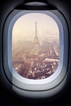 Beautiful paris cityscape from aircraft window 