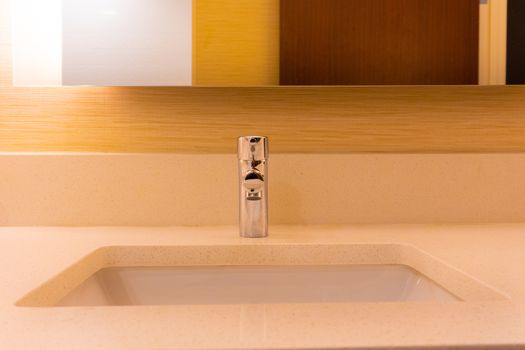 Warm colored bathroom counter with sink and mirror