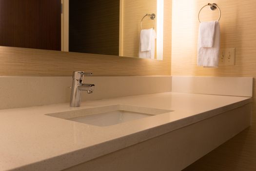 Contemporary hotel bathroom counter with contemporary sink and mirror