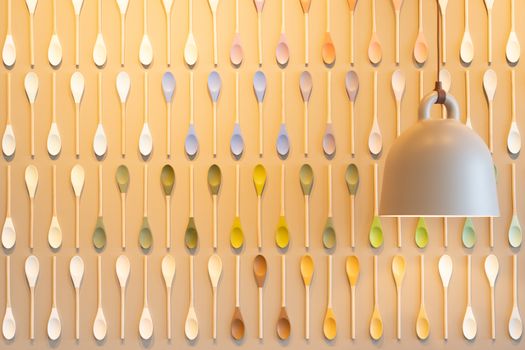 Abstract wall design with wooden colorful spoons in a contemporary cafe