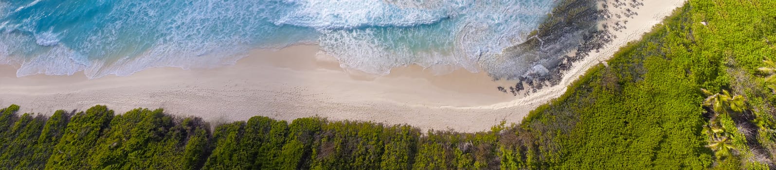 La Digue, Seychelles Island. Amazing aerial view of beach and ocean from a drone.