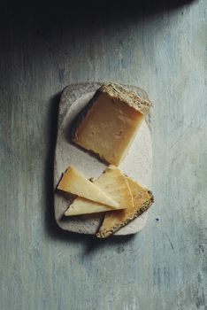 Semi-cured cheese "Villarejo Rosemary", made with raw sheep's milk and cured in Iberian lard and Romero. gold medals at the World Cheese Awards and the prize for the best cheese in the world at the Rome contest