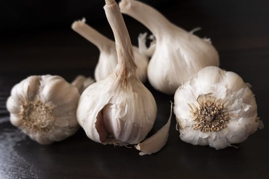 shot of garlic's & cloves on wooden background