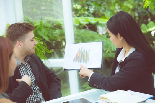 young business people making meeting and talking for analyzing marketing working at office on desk.