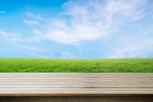 Empty wooden table with nature background - can be used for display your products.