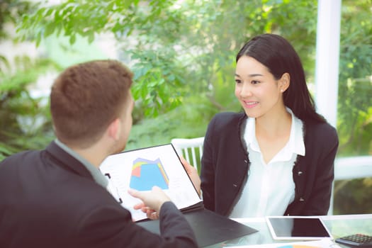 young business people making meeting and talking for analyzing marketing working at office on desk.