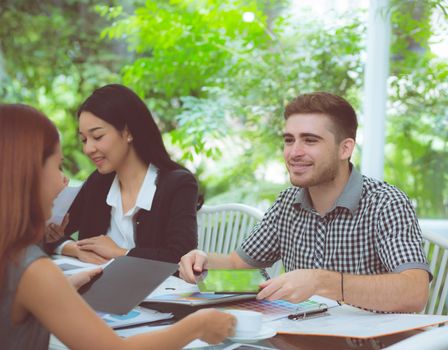 young business people making meeting and talking for analyzing marketing working at office on desk.