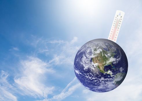 thermometer check the earth's temperature with impact of global environment concept, Elements of this image furnished by NASA.