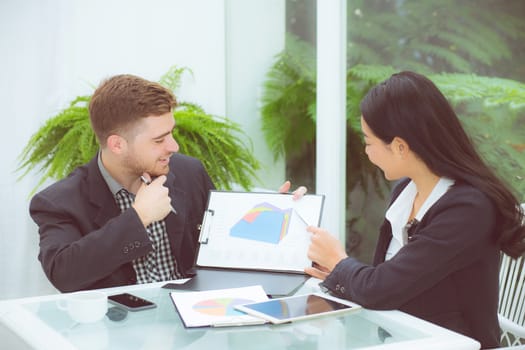 young business people making meeting and talking for analyzing marketing working at office on desk.