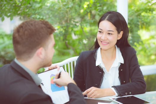 young business people making meeting and talking for analyzing marketing working at office on desk.