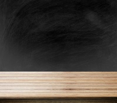 black background of blackboard, chalkboard and free space for you and desk space, can be used for display your products.