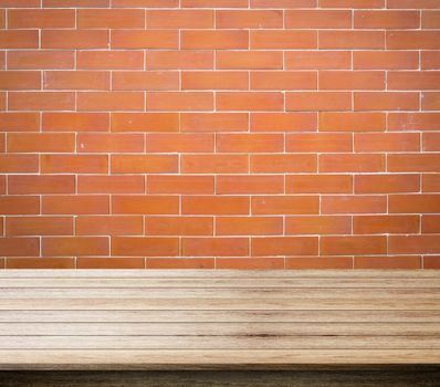red background of brick, brick and free space for you and wood desk space, can be used for display your products.