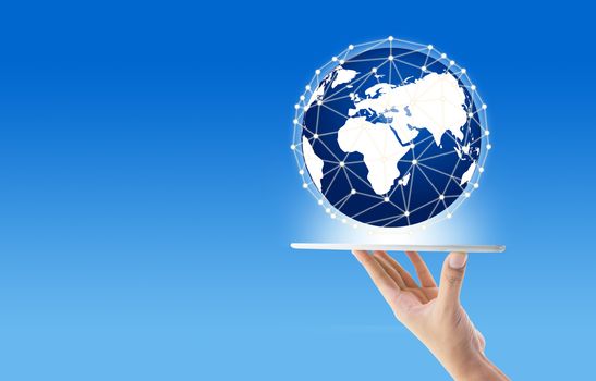 Businessman holding in hand tablet with global network communication connection concept, Elements of this image furnished by NASA.