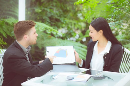 young business people making meeting and talking for analyzing marketing working at office on desk.