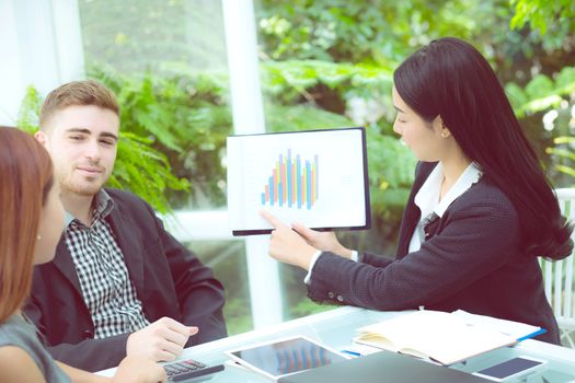 young business people making meeting and talking for analyzing marketing working at office on desk.