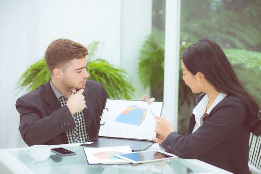 young business people making meeting and talking for analyzing marketing working at office on desk.