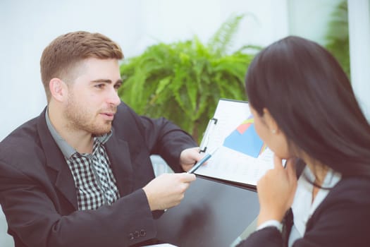 young business people making meeting and talking for analyzing marketing working at office on desk.