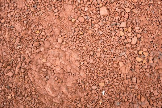 Red Brown Gravel or Soil Texture Background for Design. Real gravel texture background and small stone on ground