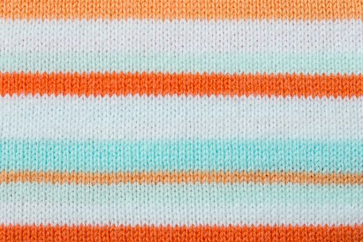 Orange knitting fabric texture background or knitted pattern background. Knitting or knitted background for design. Stripe Line knitting background. knitting texture. knitting pattern.