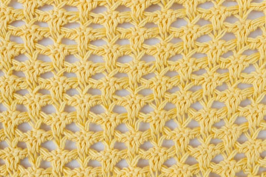Dark Yellow Knitting Pattern or Knitted Pattern Background in macro style. Knitting Pattern or Knitted Pattern in vintage style for design