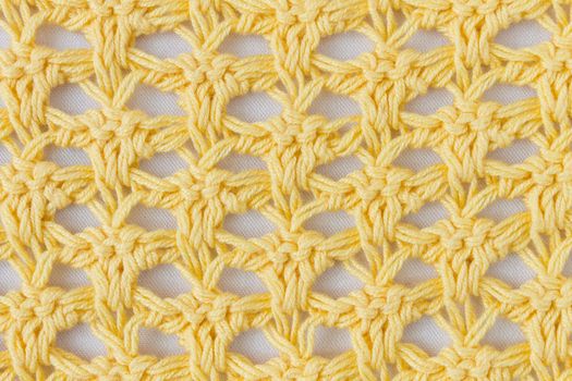 Dark Yellow Knitting Pattern or Knitted Pattern Background in macro style. Knitting Pattern or Knitted Pattern in vintage style for design