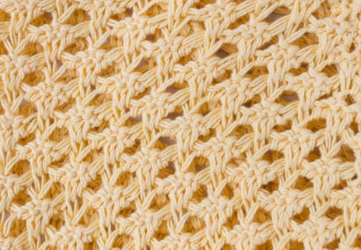 Dark Yellow Knitting Texture or Knitted Texture Background in macro style. Knitting Texture or Knitted Texture in vintage style for design