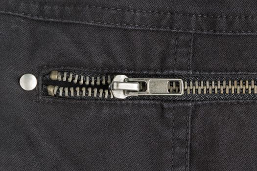 Open Brass Zip on Black Jeans Texture Background. Closed Brass Zip on Black Jeans Texture Background for Apparel Design