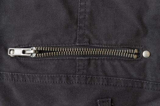 Open Brass Zip on Black Jeans Texture Background. Open Brass Zip on Black Jeans Texture Background for Apparel Design