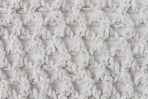 White Knitting Pattern or Knitted Pattern Background in macro style. Knitting Pattern or Knitted Pattern in vintage style for design
