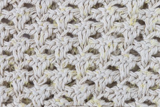 Yellow Knitting Texture or Knitted Texture Background in macro style. Knitting Texture or Knitted Texture in vintage style for design