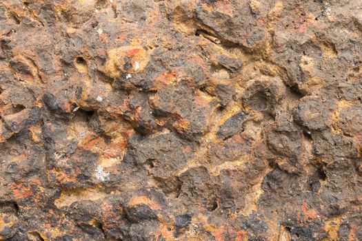 Laterite stone texture or stone background. Stone texture for design. Real stone texture. Stone texture in brown tone