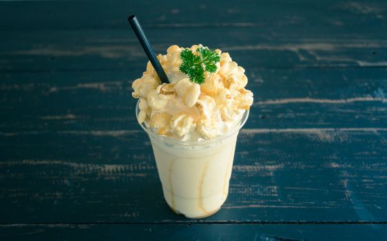 Sweet Caramel Popcorn and Whipped Cream and Fresh Milk with Parsley. Cold Beverage caramel popcorn and whipped cream and fresh milk. Caramel popcorn and whipped cream and fresh milk for food and drink category