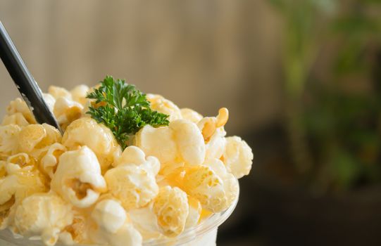 Sweet Caramel Popcorn and Whipped Cream and Fresh Milk with Parsley. Cold Beverage caramel popcorn and whipped cream and fresh milk. Caramel popcorn and whipped cream and fresh milk for food and drink category