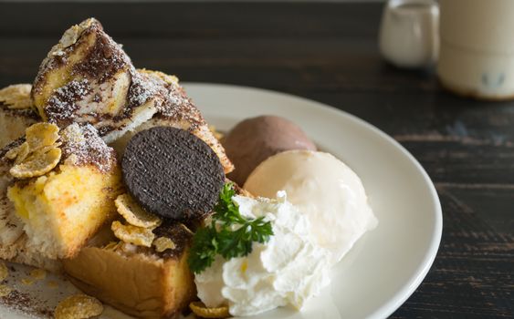 Sweet Toast Bread or Dessert and Cookies and Vanilla Chocolate Ice Cream and Cornflakes and Whipped Cream and Chocolate Cocoa Powder. Dessert toast bread for food and drink category