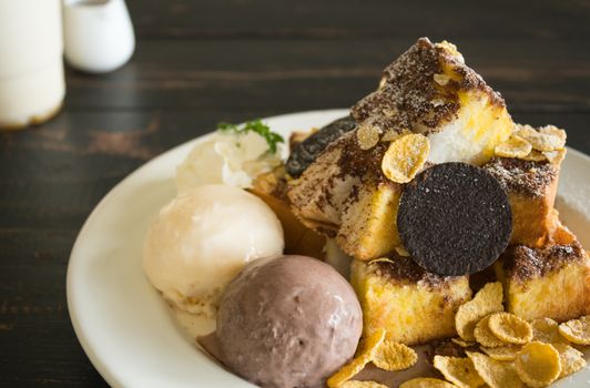 Sweet Toast Bread or Dessert and Cookies and Vanilla Chocolate Ice Cream and Cornflakes and Whipped Cream and Chocolate Cocoa Powder. Dessert toast bread for food and drink category