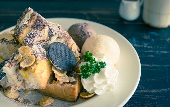 Sweet Toast Bread or Dessert and Cookies and Vanilla Chocolate Ice Cream and Cornflakes and Whipped Cream and Chocolate Cocoa Powder. Dessert toast bread for food and drink category