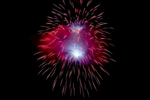 Red Sparkling Fireworks Background on Night Scene. Abstract color fireworks background and smoke on sky